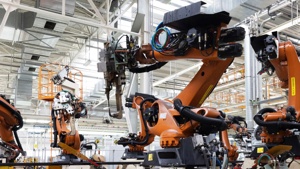Image of automobile production line with robotic arms