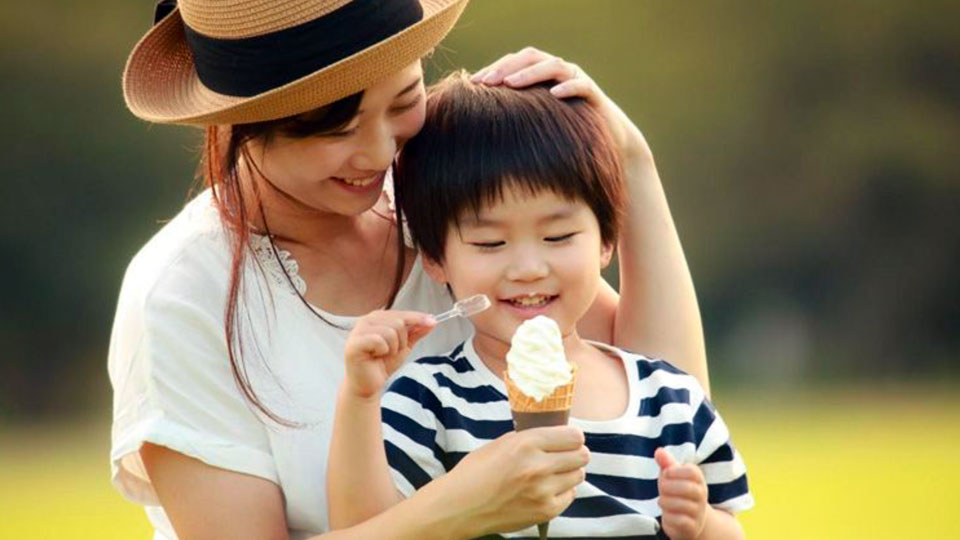 Image of a mother and son eating soft serve ice cream